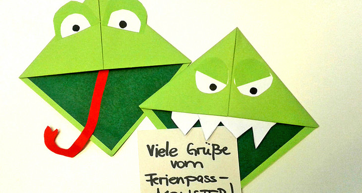 Lesezeichen aus Papier in Form des Gesichts des grünen Ferienpassmonsters
