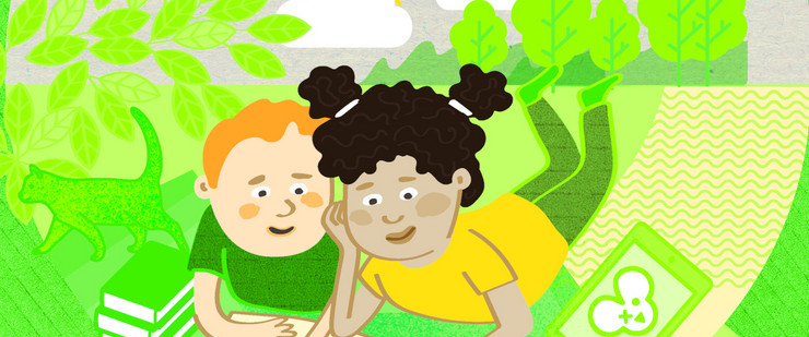 Ein Junge und ein Mädchen liegen im Grünen vor einem Buch