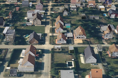 Der Ausschnitt aus dem 3D-Stadtmodell zeigt Einfamilien-Wohngebäude mit ausgeformten Dächern und fotorealistischen Oberflächen.